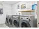 The laundry room has rows of washing machines ready for your convenience at 1 Key Capri # 302E, Treasure Island, FL 33706