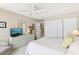 A spacious main bedroom with built in drawers, a large closet, and cozy furniture at 1 Key Capri # 302E, Treasure Island, FL 33706