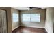 Cozy bedroom with modern ceiling fan and newly installed floors at 10502 Orange Blossom Ln, Seminole, FL 33772