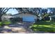 Cozy single-story home features a clean white garage door at 10502 Orange Blossom Ln, Seminole, FL 33772