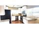 Bright kitchen showcasing stainless steel appliances and beautiful granite countertops at 10502 Orange Blossom Ln, Seminole, FL 33772