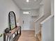 Bright foyer with hardwood floors and decor, and a staircase leading to the upper level at 11019 Leland Groves Dr, Riverview, FL 33579