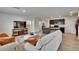 Bright living room with an open layout and views of the kitchen with granite countertops at 11019 Leland Groves Dr, Riverview, FL 33579