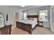 Serene main bedroom with neutral tones, two windows, and a spacious layout at 11019 Leland Groves Dr, Riverview, FL 33579
