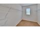Walk-in closet with carpeted floor, a window and wire shelving for storage at 11019 Leland Groves Dr, Riverview, FL 33579