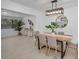 A dining room with a stylish table, modern light fixture, and decor at 112 Peterson Ln, Palm Harbor, FL 34683