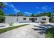 Charming single story home with well-maintained landscaping and a concrete driveway at 112 Peterson Ln, Palm Harbor, FL 34683