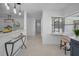 Hallway and bar area features pendant lights, stylish console table, and built-in window bench at 112 Peterson Ln, Palm Harbor, FL 34683
