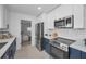 Well-equipped kitchen with stainless steel appliances, stylish cabinetry, and convenient layout for cooking at 112 Peterson Ln, Palm Harbor, FL 34683