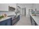 An updated kitchen with stainless steel appliances, a stylish backsplash, and a modern design at 112 Peterson Ln, Palm Harbor, FL 34683