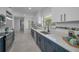 Modern kitchen with custom cabinets, stainless appliances, and beautiful countertops at 112 Peterson Ln, Palm Harbor, FL 34683
