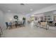 Spacious open-concept living area with comfortable seating, neutral colors, and lots of natural light at 112 Peterson Ln, Palm Harbor, FL 34683