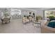 Open layout connects the kitchen, living room, and dining area, creating a harmonious flow throughout the home at 112 Peterson Ln, Palm Harbor, FL 34683