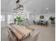 Open floor plan showcasing dining, kitchen, and living areas with modern furnishings and decor at 112 Peterson Ln, Palm Harbor, FL 34683