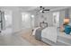 The main bedroom offers a tranquil retreat with a ceiling fan, natural light, and access to the bathroom at 112 Peterson Ln, Palm Harbor, FL 34683