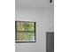 Bright room featuring a window with blinds and a gray electrical panel on the white wall at 112 Peterson Ln, Palm Harbor, FL 34683