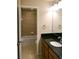 This bathroom features granite countertops and a shower and tub combination at 11408 Scribner Station Ln, Lithia, FL 33547