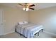 Neutral bedroom featuring a ceiling fan and an abundance of natural light at 11408 Scribner Station Ln, Lithia, FL 33547