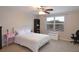 Bright bedroom with large window and comfortable furniture at 11408 Scribner Station Ln, Lithia, FL 33547