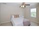 Bedroom features a ceiling fan and a neutral color palette at 11408 Scribner Station Ln, Lithia, FL 33547