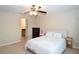 Cozy bedroom with ceiling fan, closet, and ensuite bathroom at 11408 Scribner Station Ln, Lithia, FL 33547