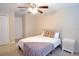 Bedroom featuring a ceiling fan and a calming neutral color palette at 11408 Scribner Station Ln, Lithia, FL 33547