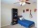 Bedroom includes a ceiling fan and natural light at 11408 Scribner Station Ln, Lithia, FL 33547