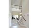 Open floorplan with a view of a staircase, entry, and living room featuring large windows at 11408 Scribner Station Ln, Lithia, FL 33547
