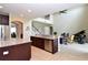Open concept kitchen with granite countertops and stainless steel appliances at 11408 Scribner Station Ln, Lithia, FL 33547
