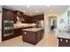 Open kitchen with a large island, stainless steel appliances, and granite countertops at 11408 Scribner Station Ln, Lithia, FL 33547