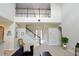Bright living room with high ceilings and a staircase to the second floor at 11408 Scribner Station Ln, Lithia, FL 33547