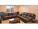 Living room with comfortable seating, natural light, and a workspace at 11408 Scribner Station Ln, Lithia, FL 33547