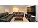 Finished basement living room features comfortable seating and entertainment center at 11408 Scribner Station Ln, Lithia, FL 33547