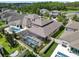Home featuring a screened pool and outdoor living area in a desirable neighborhood at 11881 Ranchers Gap Dr, Odessa, FL 33556