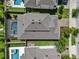 Home with screened pool, well-manicured lawn and landscaped backyard oasis at 11881 Ranchers Gap Dr, Odessa, FL 33556