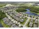 An aerial view of a community with houses and beautiful lakes in the background at 11881 Ranchers Gap Dr, Odessa, FL 33556