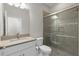 Modern bathroom featuring a glass-enclosed shower, a modern sink and vanity at 11881 Ranchers Gap Dr, Odessa, FL 33556