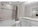 Bathroom with a shower and tub combination, a modern sink and vanity at 11881 Ranchers Gap Dr, Odessa, FL 33556
