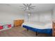 Spacious bedroom features wood-look floors and multiple closets for ample storage at 11881 Ranchers Gap Dr, Odessa, FL 33556