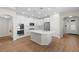 Modern kitchen with white cabinets, stainless steel appliances, a large island, and recessed lighting at 11881 Ranchers Gap Dr, Odessa, FL 33556