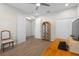 Spacious home office featuring wood floors, large windows, built-in storage, and a comfortable seating area at 11881 Ranchers Gap Dr, Odessa, FL 33556