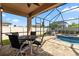 Enjoy the screened-in pool, patio, and outdoor dining area for relaxing entertainment at 11881 Ranchers Gap Dr, Odessa, FL 33556