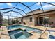 Relax and enjoy the screened-in pool with a spa and brick paver patio at 11881 Ranchers Gap Dr, Odessa, FL 33556