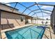 Beautiful screened-in pool and spa area offers the perfect outdoor retreat at 11881 Ranchers Gap Dr, Odessa, FL 33556