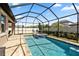 Screened-in pool and spa with outdoor seating make the perfect backyard oasis at 11881 Ranchers Gap Dr, Odessa, FL 33556