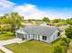 Well-maintained single-Gathering home features lush front yard and a paved driveway at 12546 Brookside St, Spring Hill, FL 34609