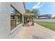 Open back patio with ample space for outdoor seating and entertaining, with view to backyard at 1291 Blackrush Dr, Tarpon Springs, FL 34689