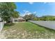 Large backyard with green grass and ample space for outdoor activities and relaxation at 1291 Blackrush Dr, Tarpon Springs, FL 34689