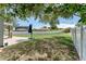 Spacious backyard with lush greenery, a patio, and privacy fencing, creating a serene outdoor oasis at 1291 Blackrush Dr, Tarpon Springs, FL 34689