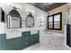 Stylish bathroom featuring a double sink vanity, modern fixtures and a soaking tub at 1291 Blackrush Dr, Tarpon Springs, FL 34689